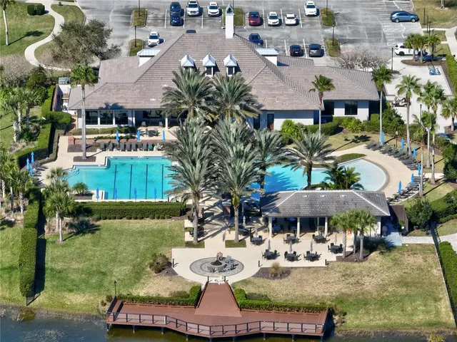 an aerial view of a house with garden space and patio