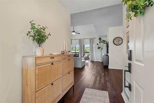 a kitchen with cabinets and wooden floor
