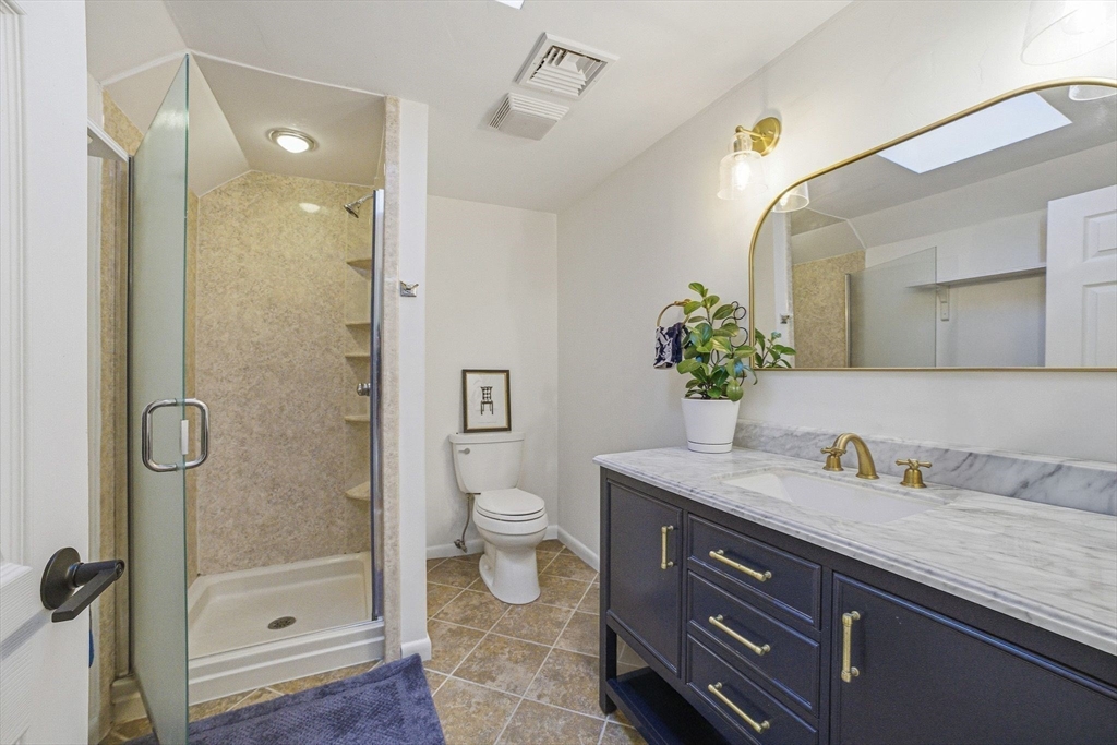 6 Montaup Road, Unit 6 Sharon, MA 02067 - Photo 15 of 35 a bathroom with a granite countertop sink a toilet and shower