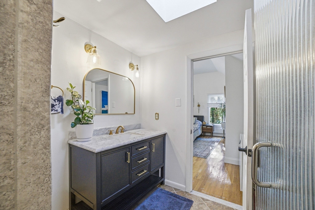6 Montaup Road, Unit 6 Sharon, MA 02067 - Photo 16 of 35 a bathroom with a sink vanity and a mirror