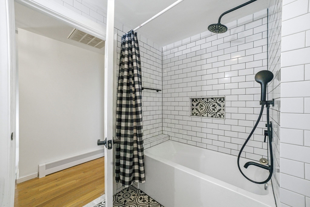 6 Montaup Road, Unit 6 Sharon, MA 02067 - Photo 18 of 35 a bathroom with a bathtub and shower