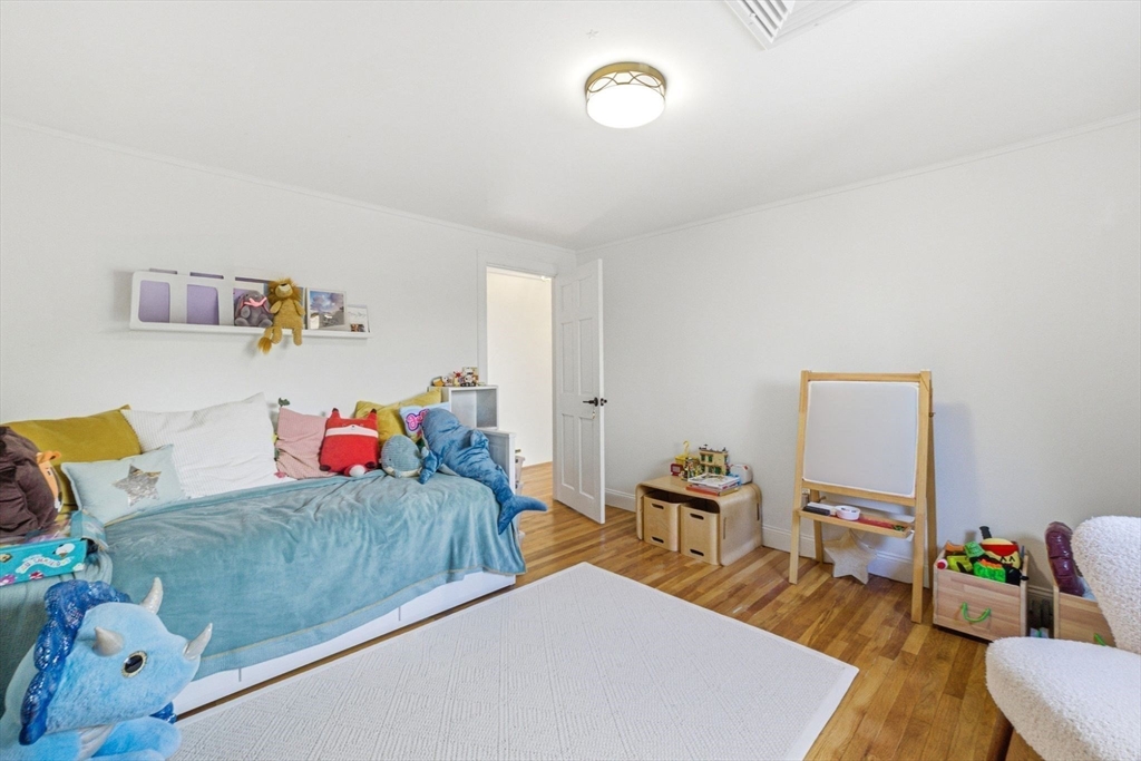 6 Montaup Road, Unit 6 Sharon, MA 02067 - Photo 20 of 35 a bedroom with a bed and a couch