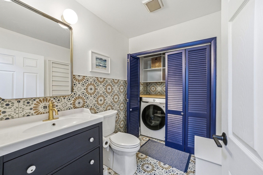 6 Montaup Road, Unit 6 Sharon, MA 02067 - Photo 23 of 35 a bathroom with a toilet sink and mirror