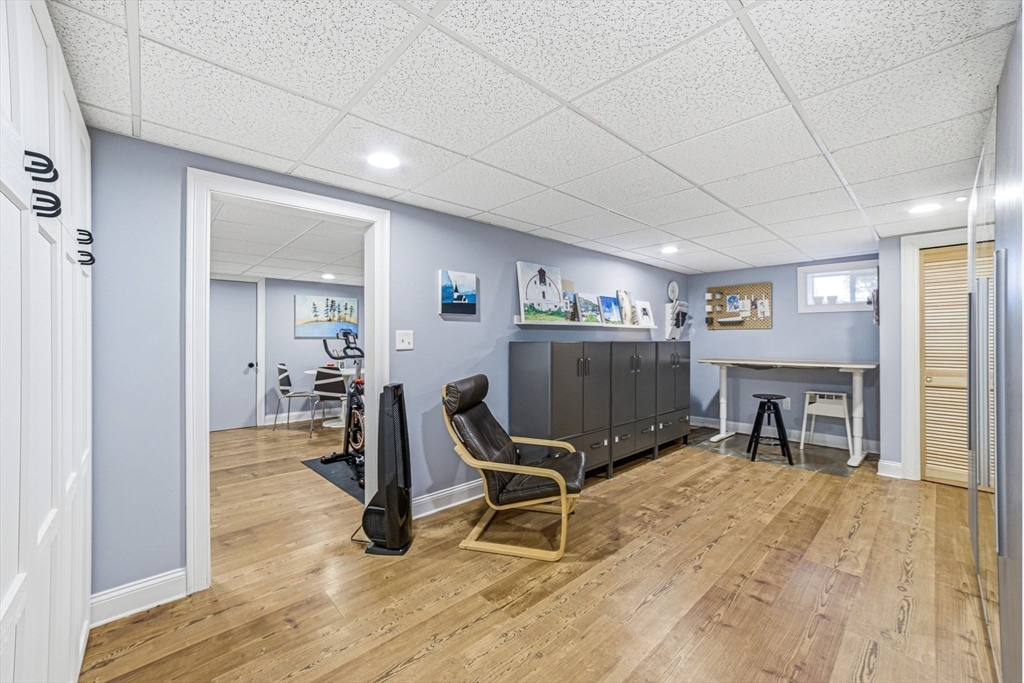 6 Montaup Road, Unit 6 Sharon, MA 02067 - Photo 25 of 35 a room with furniture and a wooden floor