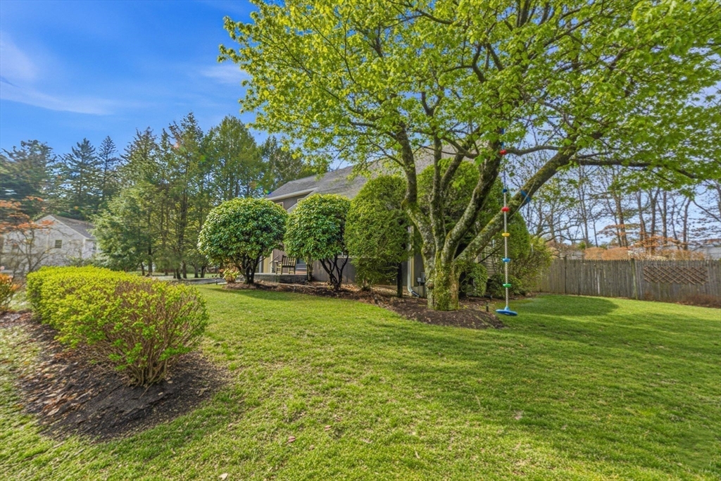 6 Montaup Road, Unit 6 Sharon, MA 02067 - Photo 29 of 35 a backyard of a house with lots of green space