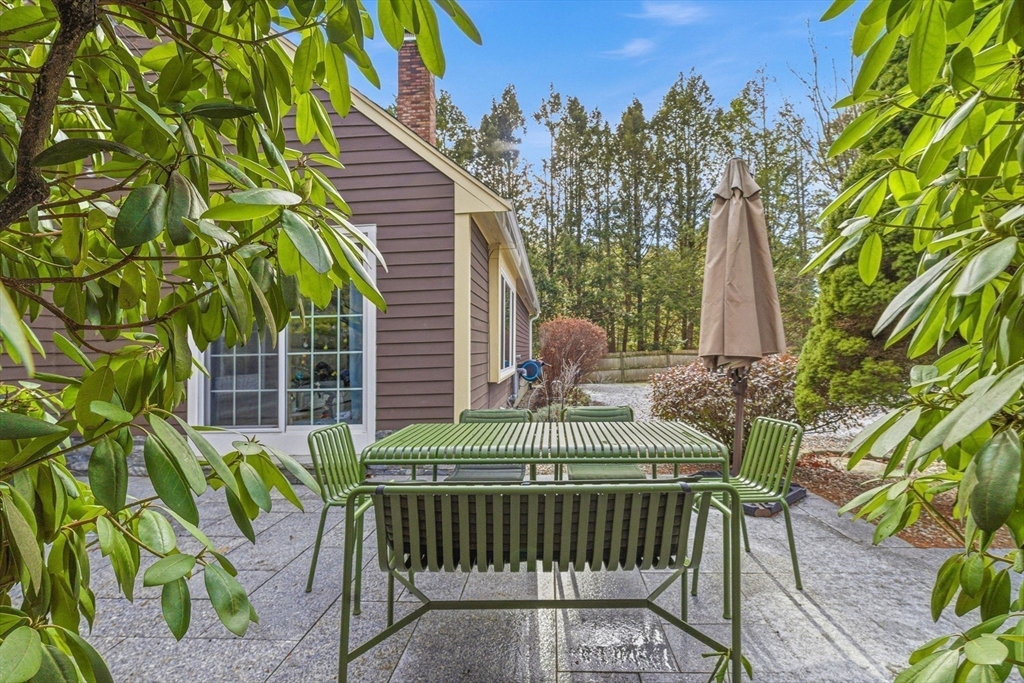 6 Montaup Road, Unit 6 Sharon, MA 02067 - Photo 30 of 35 a view of a chair and table in the balcony