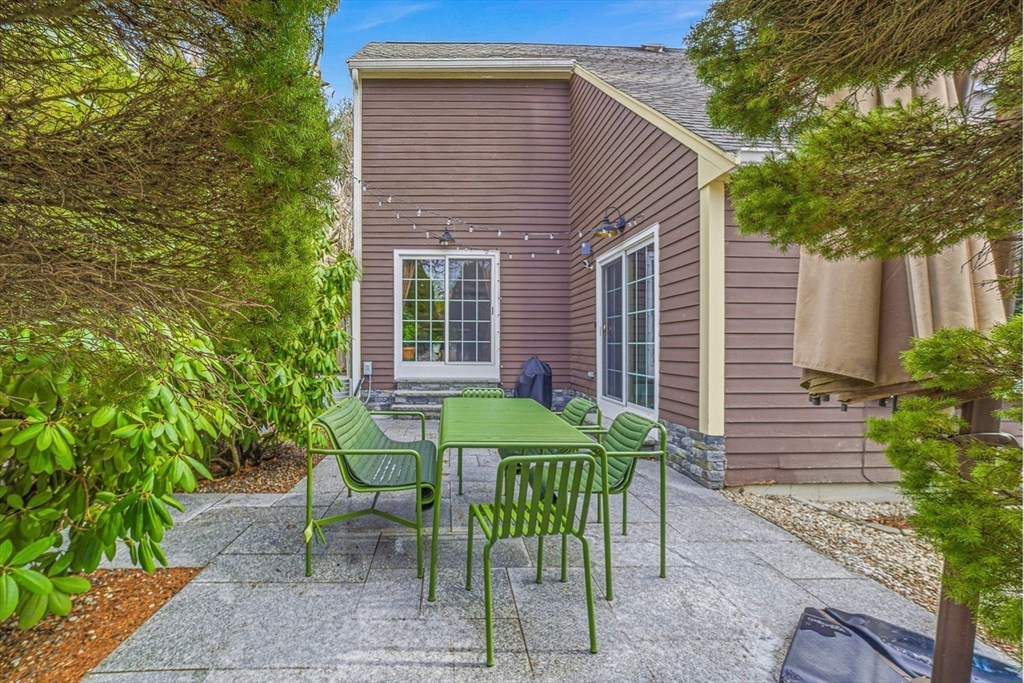 6 Montaup Road, Unit 6 Sharon, MA 02067 - Photo 31 of 35 a view of a chair and table in backyard of the house