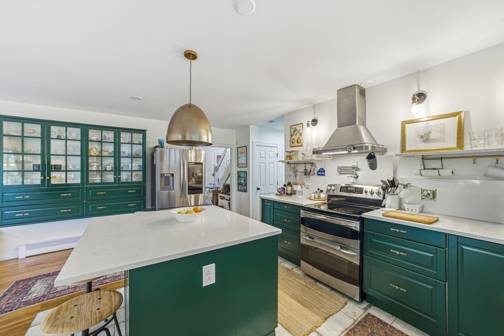6 Montaup Road, Unit 6 Sharon, MA 02067 - Photo 8 of 35 a kitchen with stainless steel appliances kitchen island sink stove and cabinets