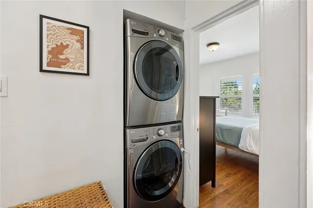 a view of a bedroom with washer and dryer
