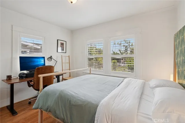 a bedroom with double bed and a window