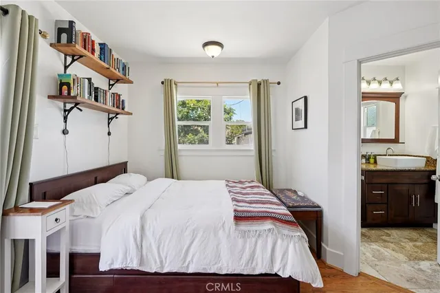 a bedroom with a bed and a dresser