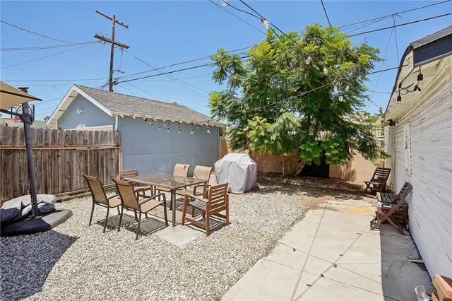 a view of a patio with a table and chairs