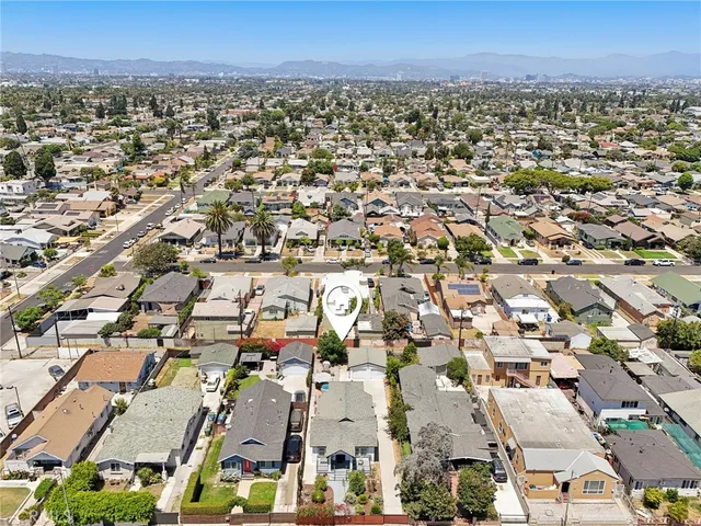 an aerial view of a city with lots of residential buildings