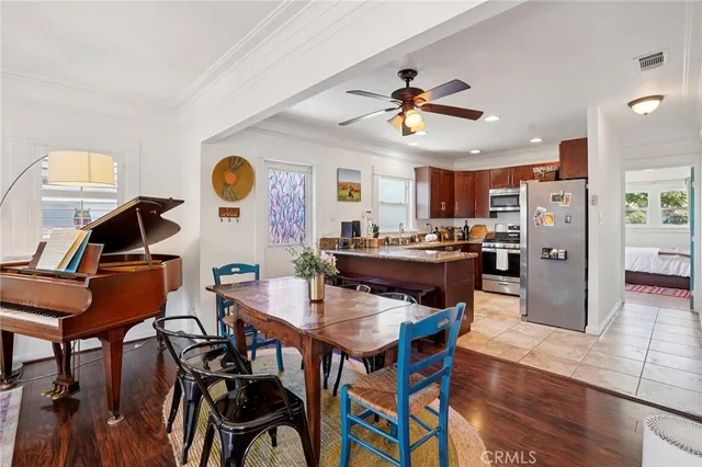 a view of a dining room with furniture and wooden floor