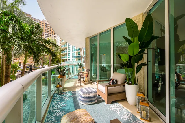 a balcony view with outdoor seating and city view