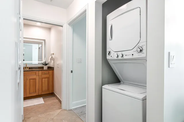 a view of bathroom with a washer and dryer