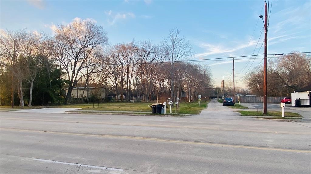 0 Massey Tompkins Road Baytown, TX 77521 - Photo 2 of 4 a garden with trees in the background