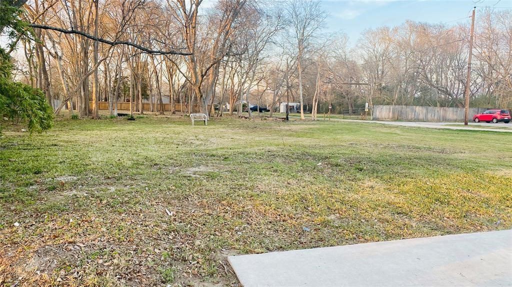 0 Massey Tompkins Road Baytown, TX 77521 - Photo 4 of 4 a backyard of apartments with large trees