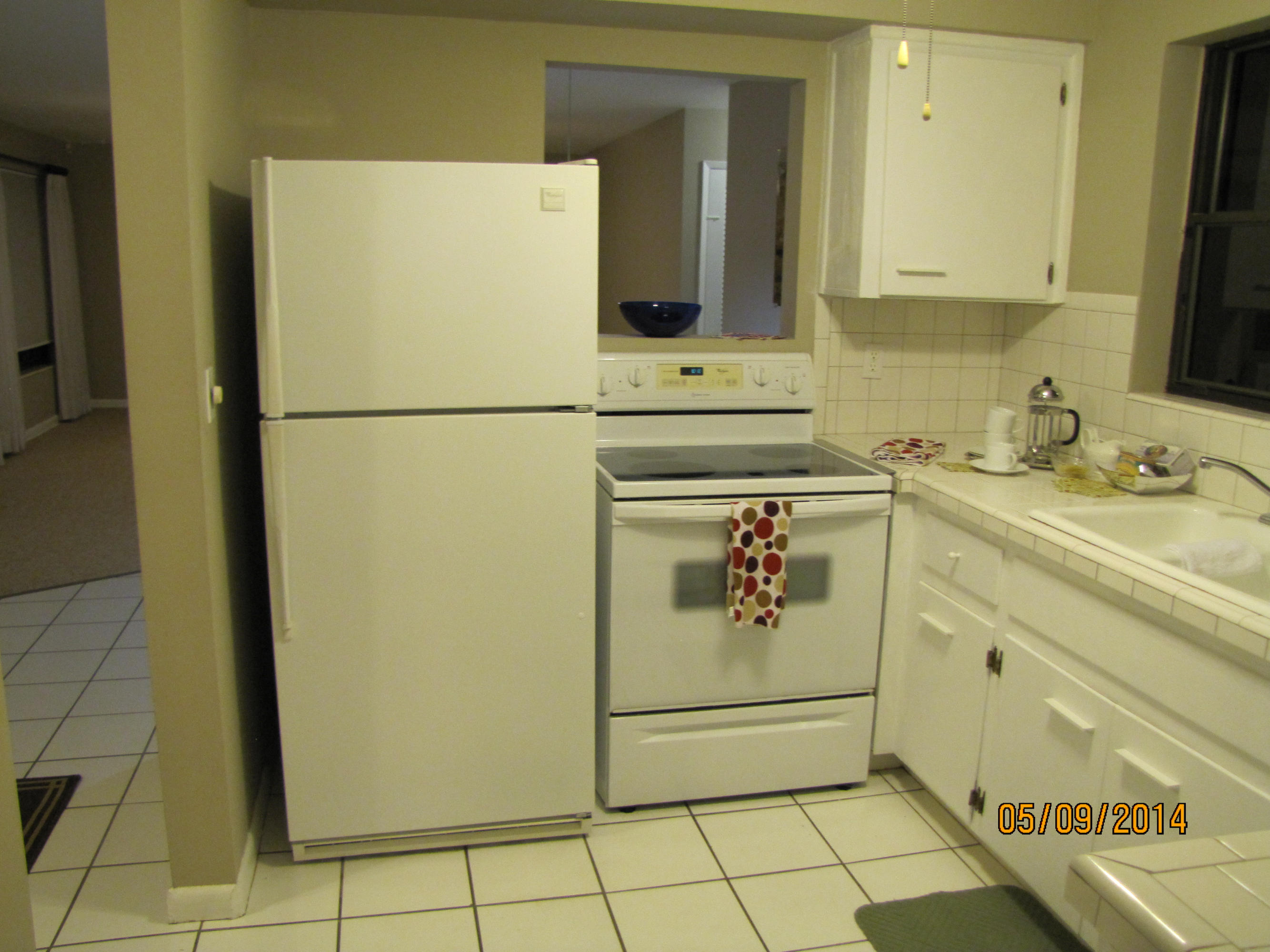 2145 Northeast 4th Way Boca Raton, FL 33431 - Photo 27 of 41 a bathroom with a sink and a refrigerator