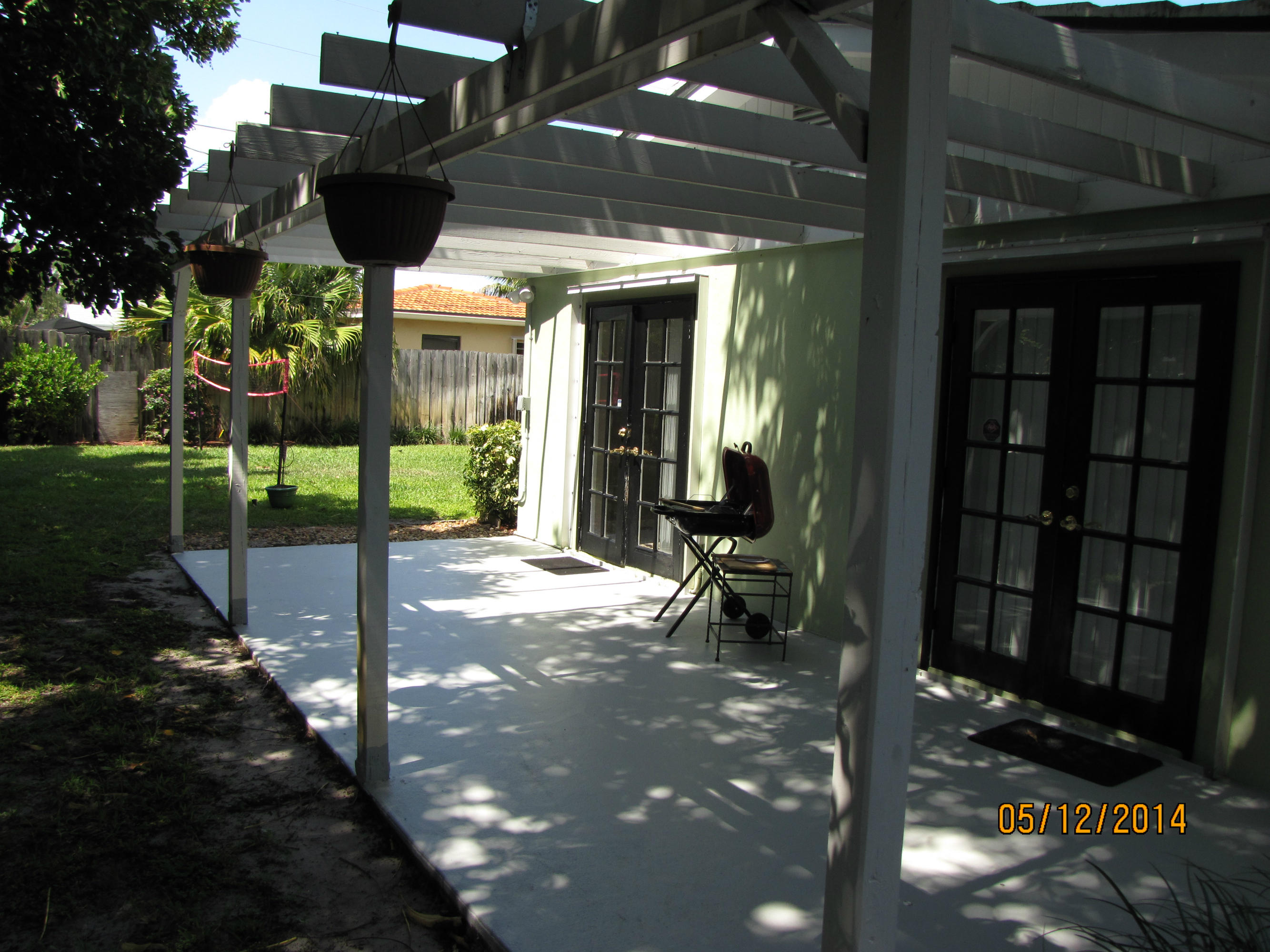 2145 Northeast 4th Way Boca Raton, FL 33431 - Photo 5 of 41 a view of a porch with a table and chairs