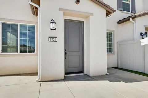 a view of a wrought iron fences in front of house