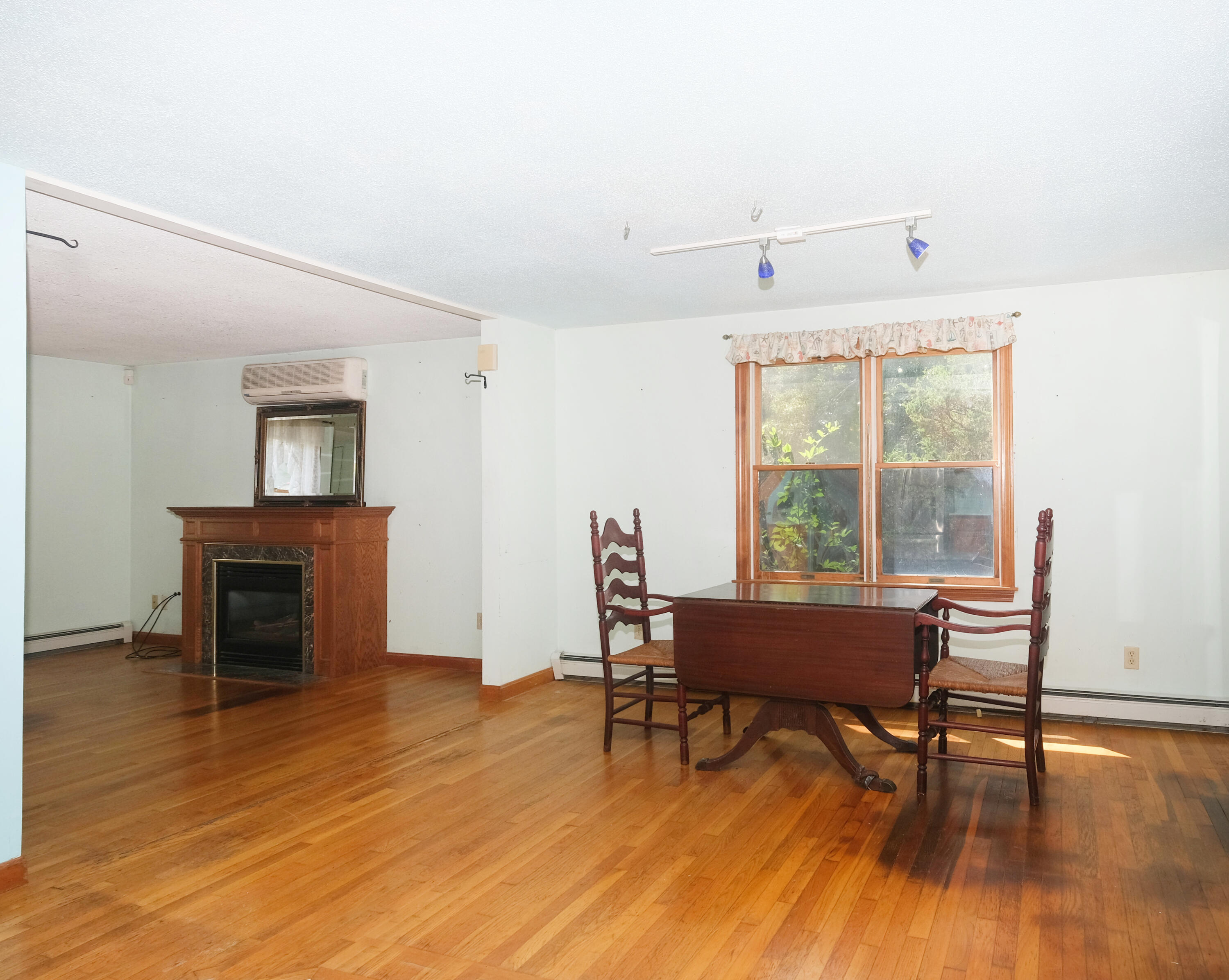 16 Partridge Lane Harwich, MA 02645 - Photo 11 of 44 a living room with furniture and a wooden floor