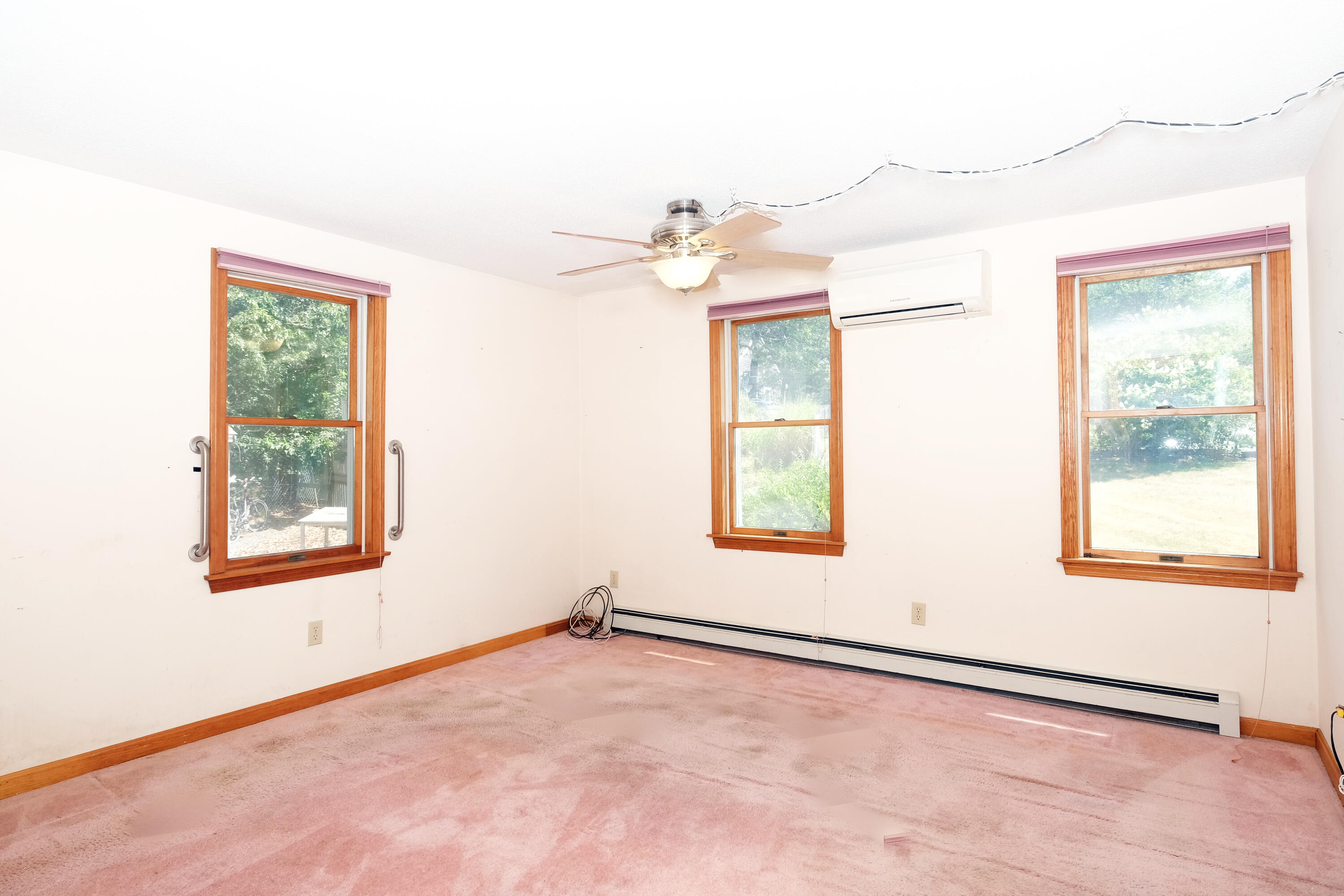 16 Partridge Lane Harwich, MA 02645 - Photo 18 of 44 an empty room with a window and a fan
