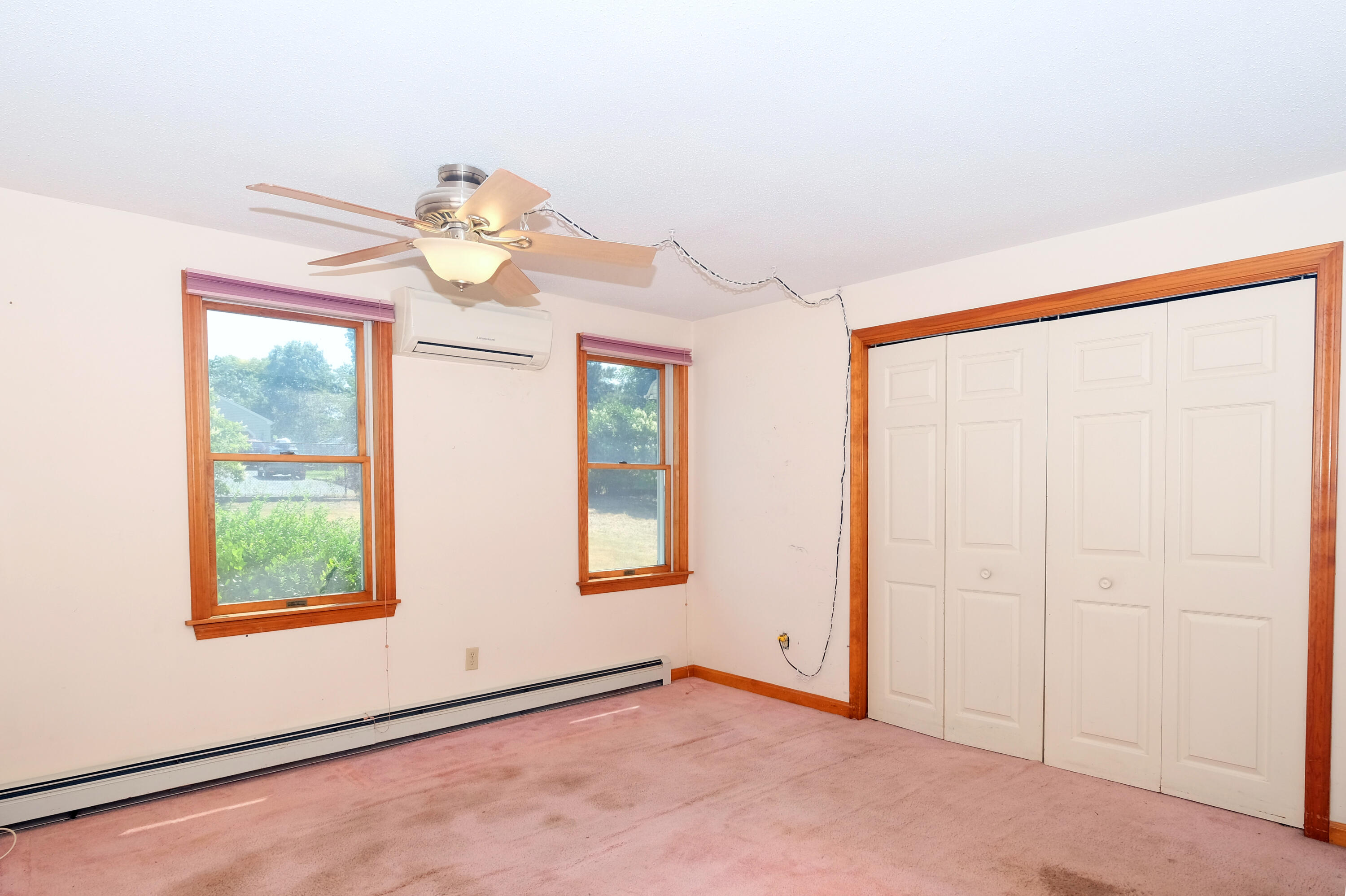 16 Partridge Lane Harwich, MA 02645 - Photo 19 of 44 an empty room with windows and fan
