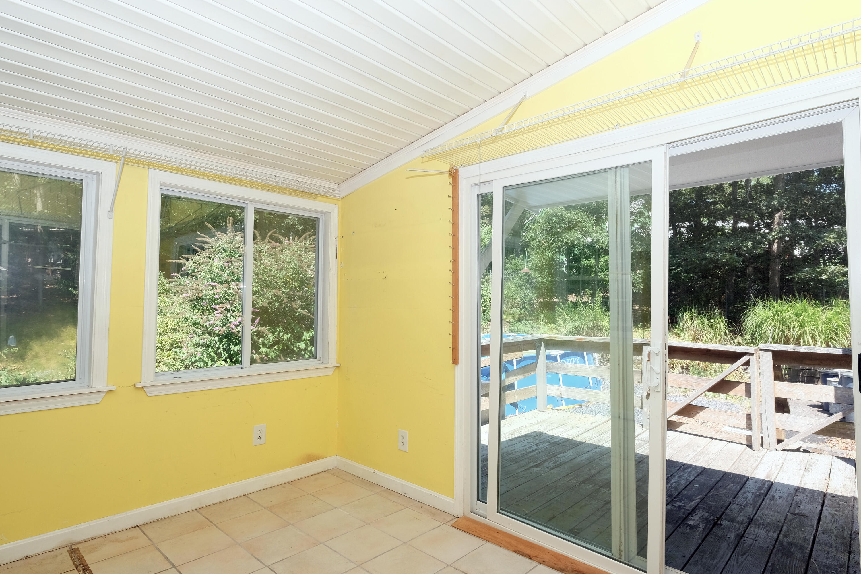 16 Partridge Lane Harwich, MA 02645 - Photo 24 of 44 a living room with hardwood floor and a floor to ceiling window
