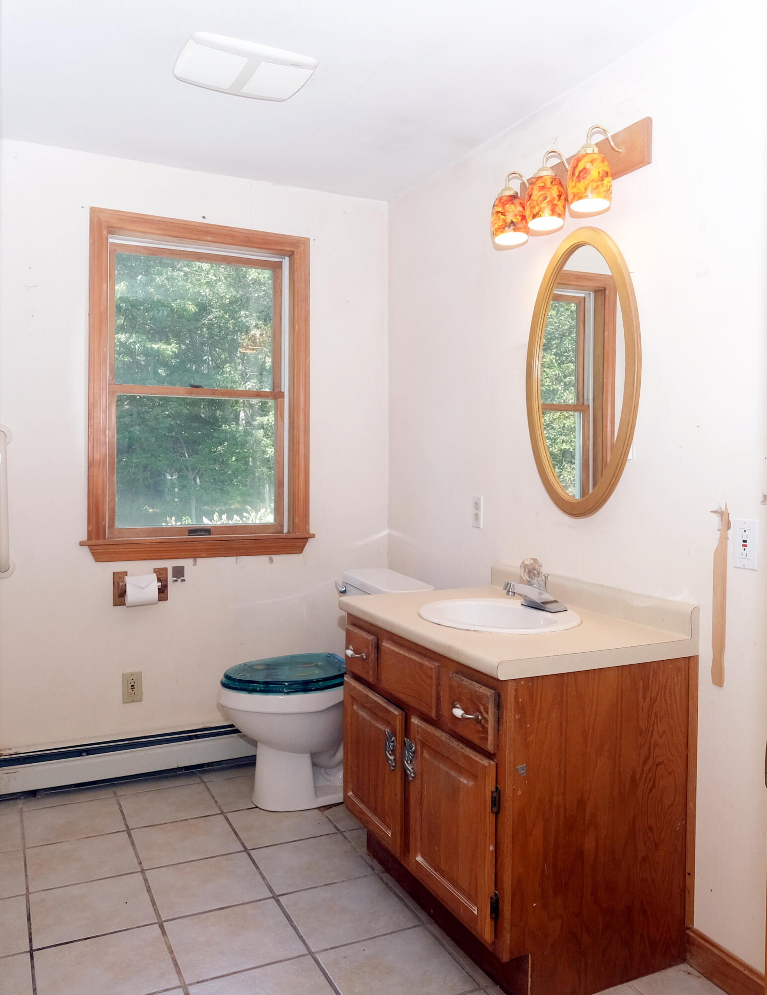 16 Partridge Lane Harwich, MA 02645 - Photo 25 of 44 a bathroom with a sink a mirror and a window
