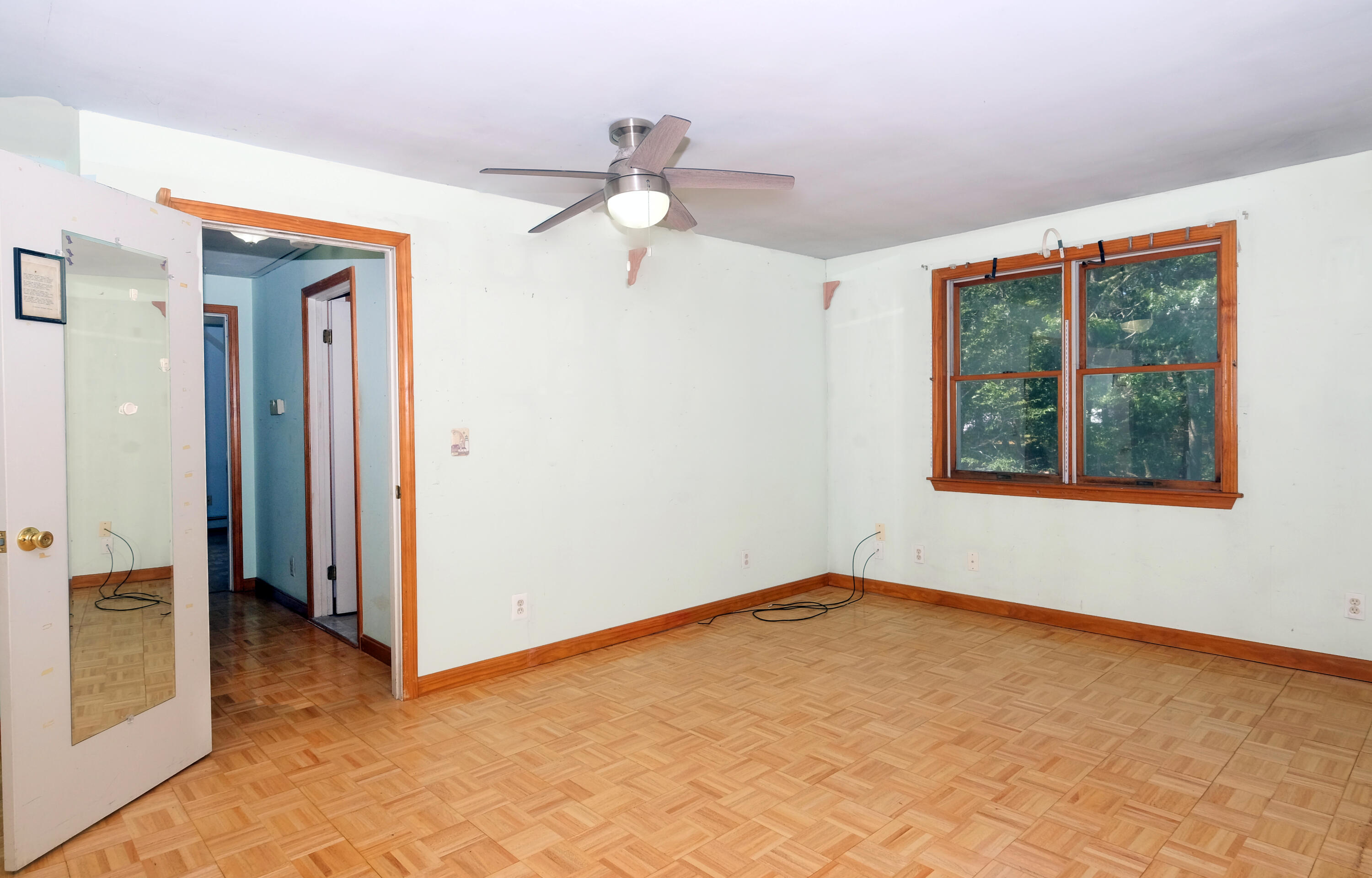 16 Partridge Lane Harwich, MA 02645 - Photo 34 of 44 an empty room with a window and a ceiling fan