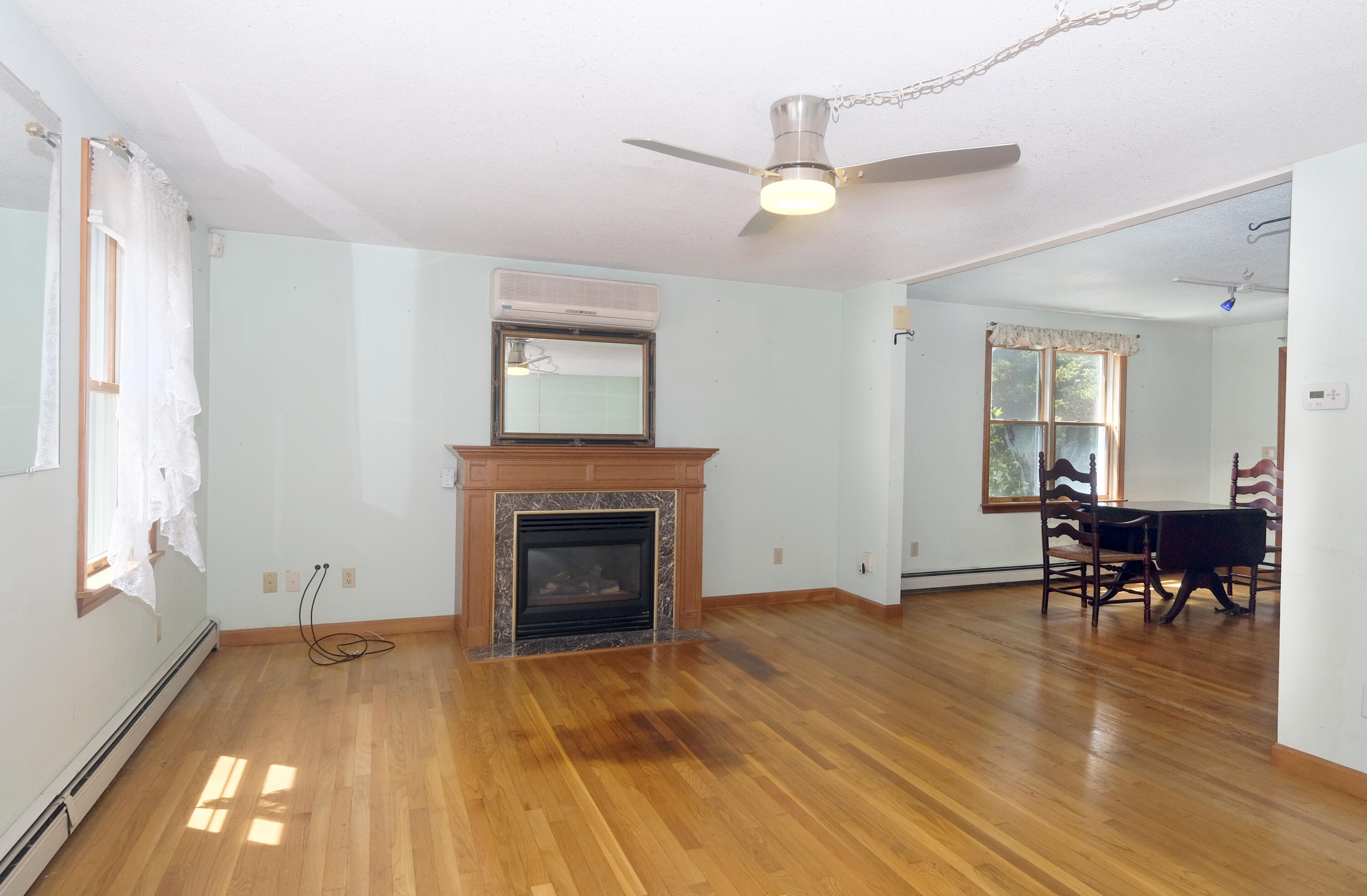 16 Partridge Lane Harwich, MA 02645 - Photo 4 of 44 a view of livingroom with furniture fireplace and wooden floor