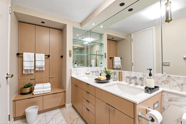 a bathroom with a double vanity sink and a mirror