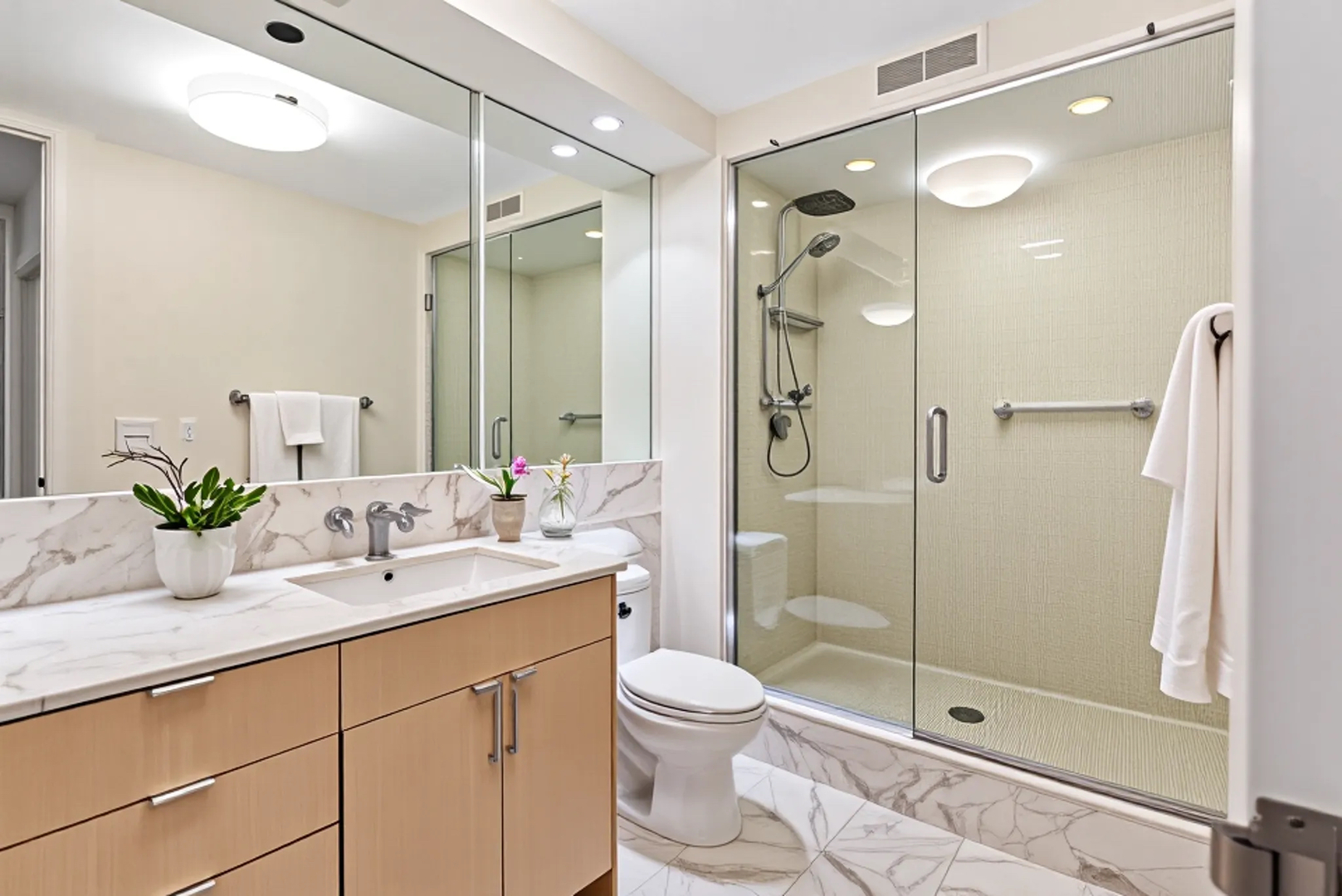 1410 North State Parkway, Unit 10B Chicago, IL 60610 - Photo 19 of 25 a bathroom with a double vanity sink toilet and shower
