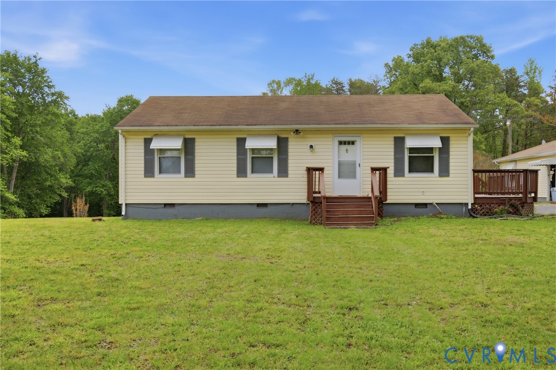 3590 Belle Meade Road Bumpass, VA 23024 - Photo 2 of 20 a front view of a house with a garden