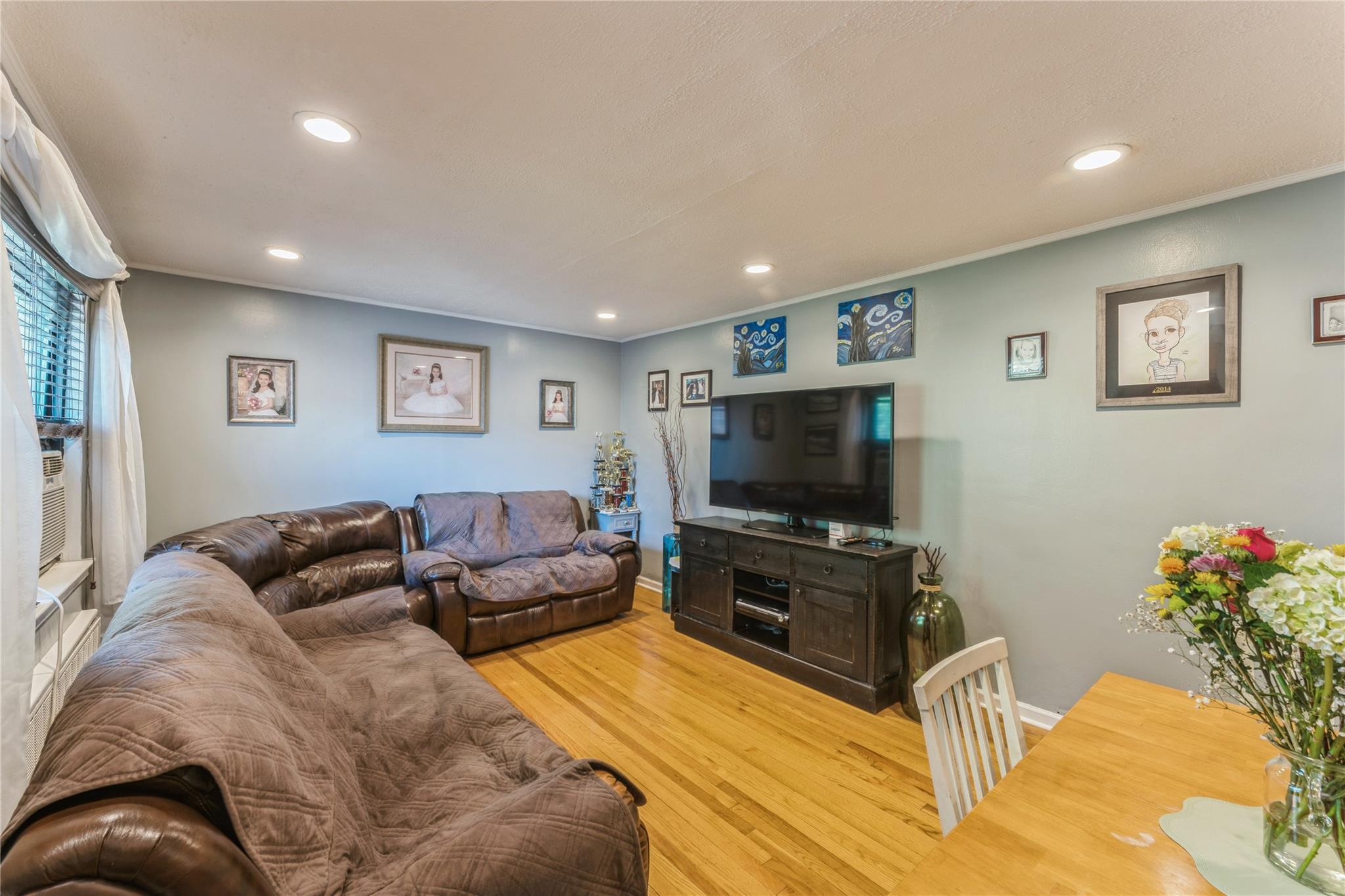 217-22 73rd Avenue, Unit UPPR Queens, NY 11364 - Photo 6 of 17 Living room with light wood-style floors, recessed lighting, and crown molding