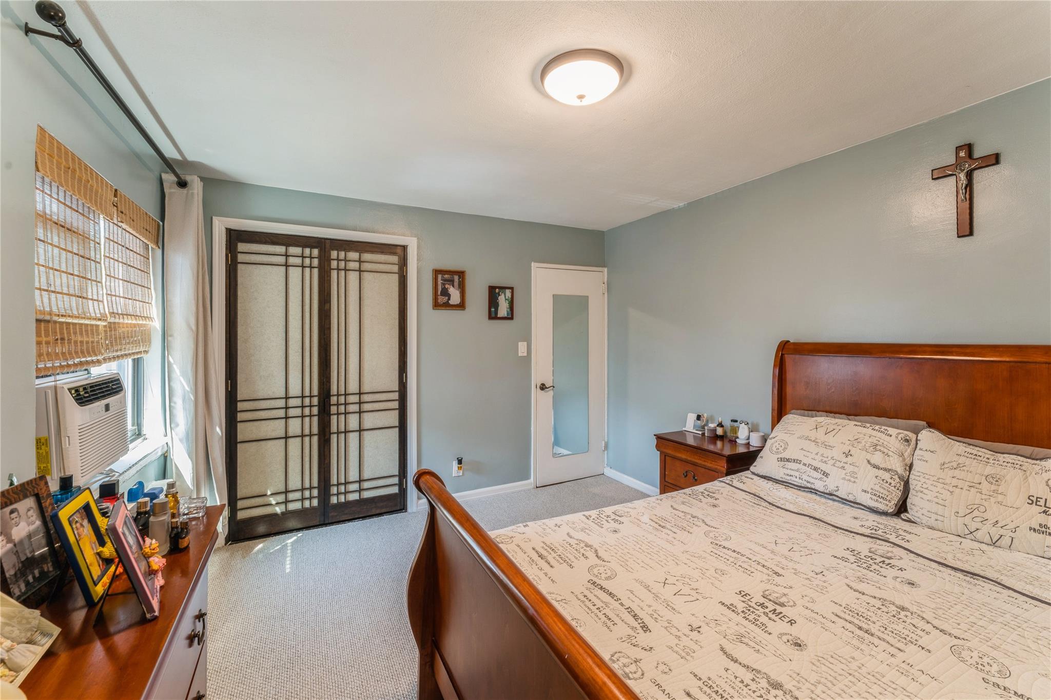 217-22 73rd Avenue, Unit UPPR Queens, NY 11364 - Photo 8 of 17 Carpeted bedroom featuring baseboards and cooling unit