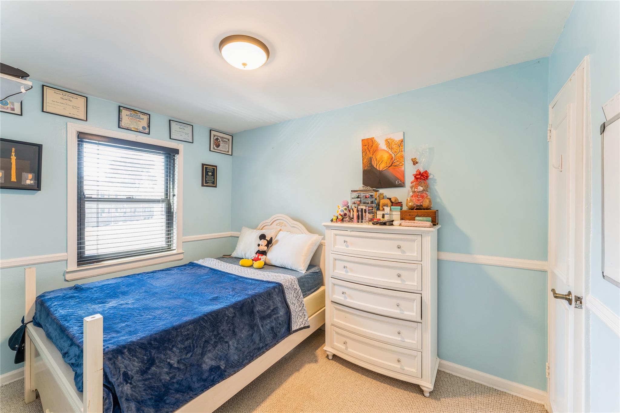 217-22 73rd Avenue, Unit UPPR Queens, NY 11364 - Photo 10 of 17 Bedroom with light colored carpet