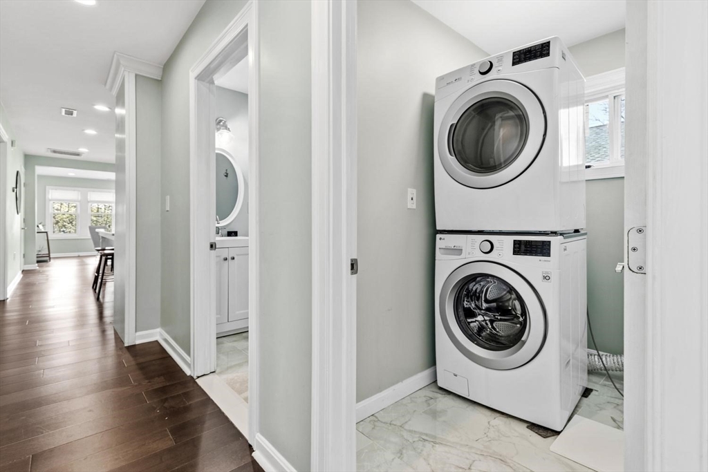 63 Century Street, Unit 2 Medford, MA 02155 - Photo 21 of 35 a view of a hallway with washer and dryer
