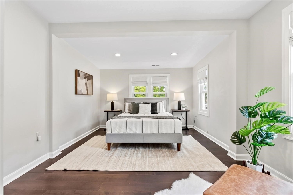 63 Century Street, Unit 2 Medford, MA 02155 - Photo 23 of 35 a living room with furniture and a potted plant