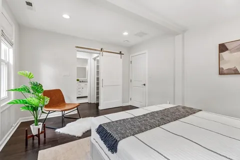 a bedroom with a bed and furniture