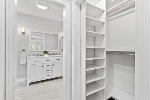 a bathroom with a sink a vanity and a mirror