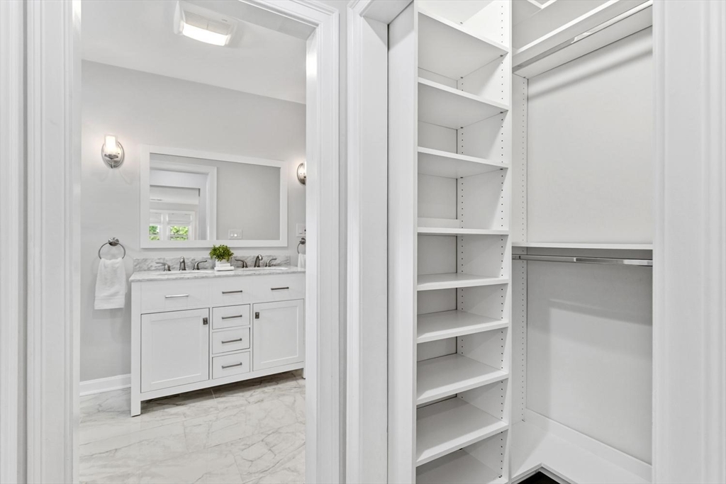 63 Century Street, Unit 2 Medford, MA 02155 - Photo 27 of 35 a room with white cabinets and window