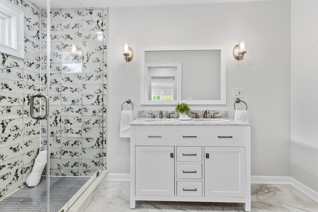 63 Century Street, Unit 2 Medford, MA 02155 - Photo 28 of 35 a bathroom with a sink a vanity and a mirror