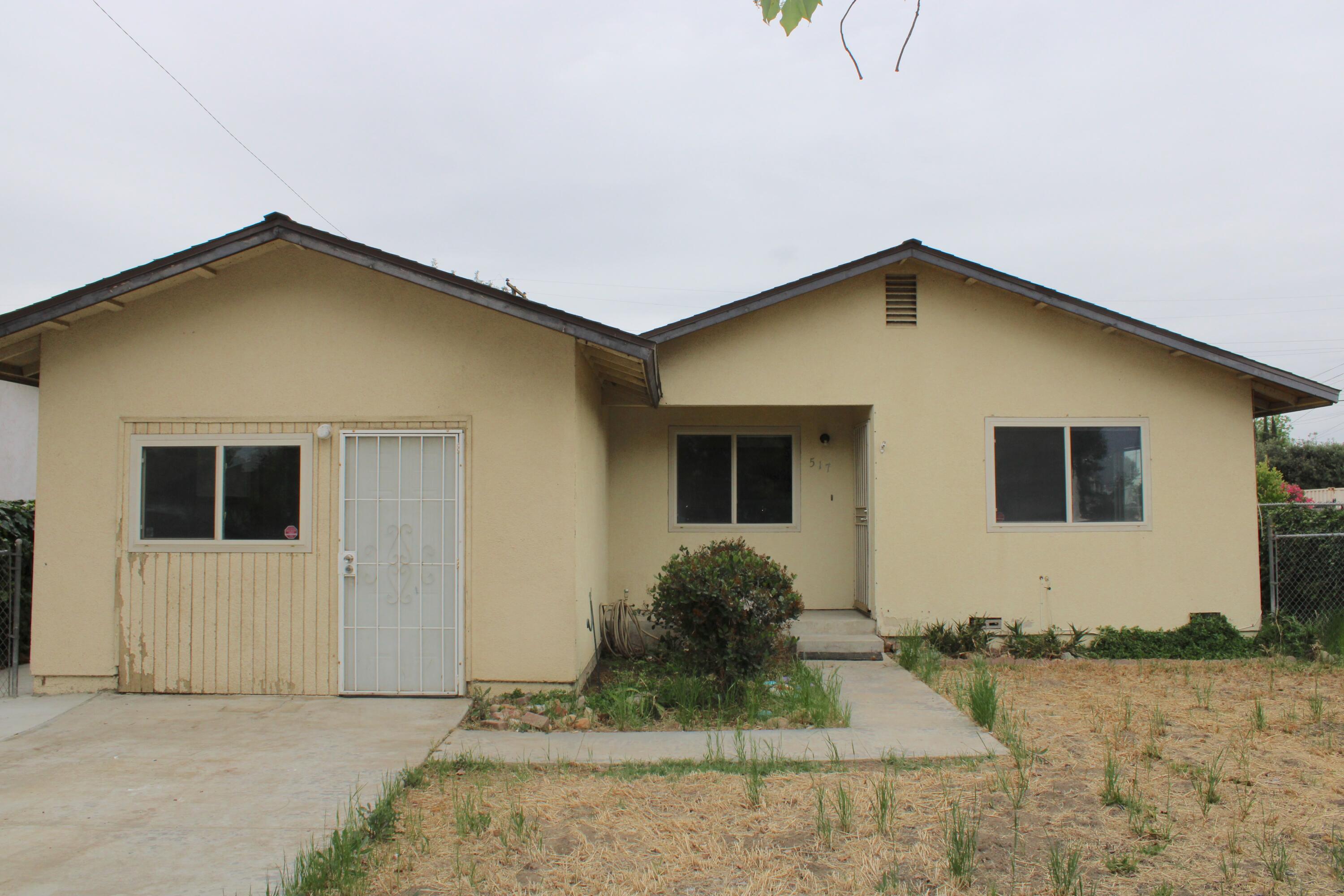 517 South R Street Tulare, CA 93274 - Photo 2 of 21 a front view of a house
