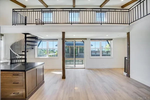 a view of front door and porch with wooden floor