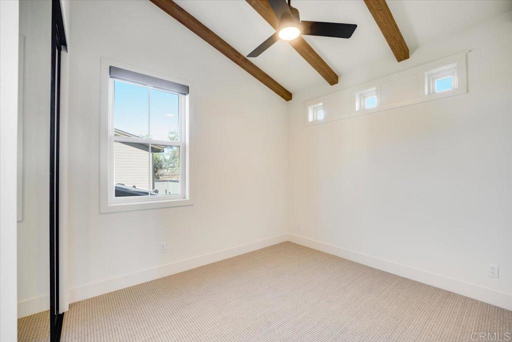 327 D Street Ramona, CA 92065 - Photo 15 of 26 an empty room with a window and a ceiling fan