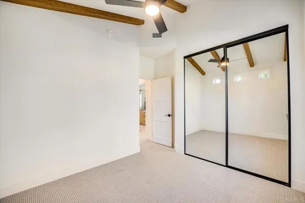 a view of a bathroom with a shower and closet