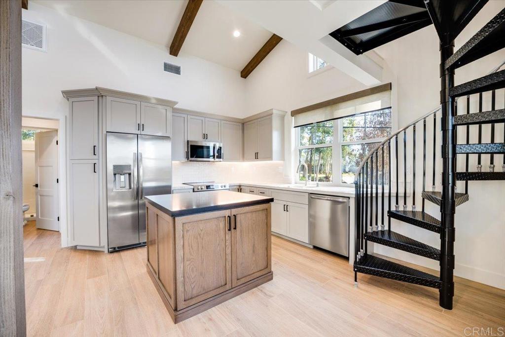 327 D Street Ramona, CA 92065 - Photo 7 of 26 a kitchen with appliances cabinets and a sink