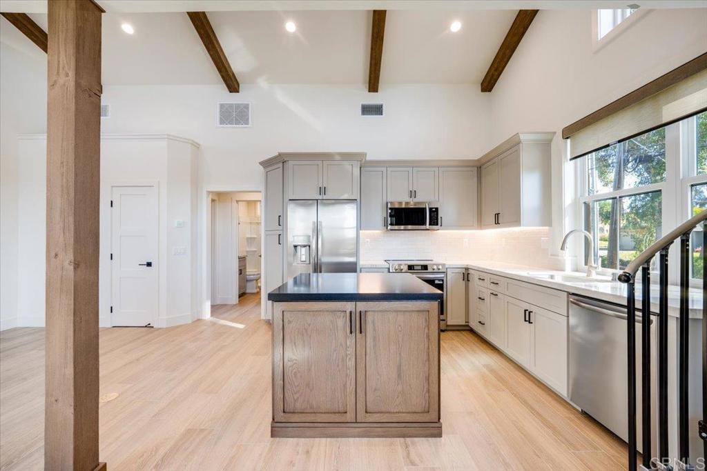 327 D Street Ramona, CA 92065 - Photo 8 of 26 a kitchen with stainless steel appliances granite countertop a sink stove and refrigerator